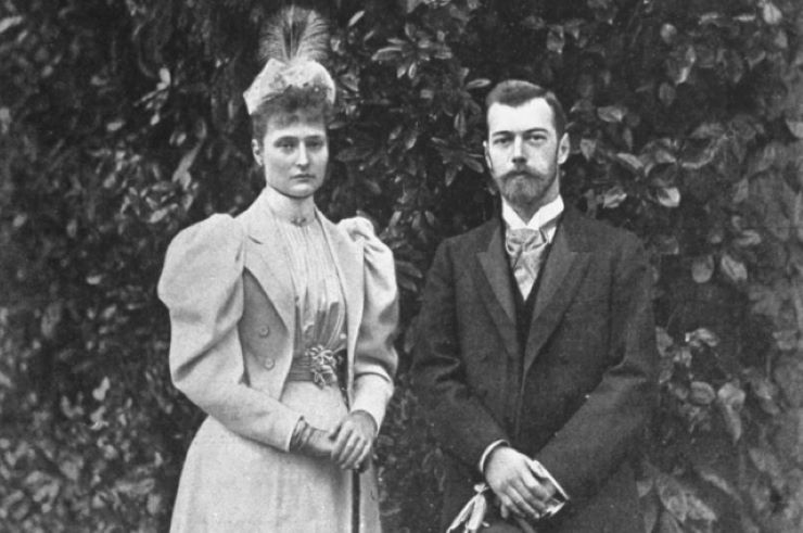 standing photo of Nicholas II and his wife